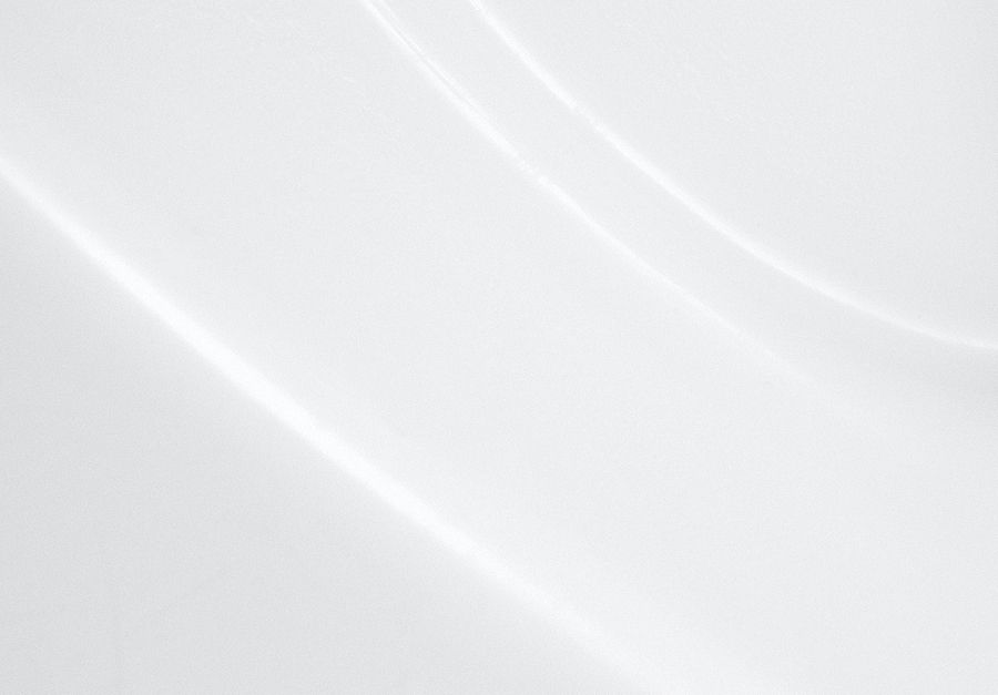 Abstract white textured surface with subtle curves.