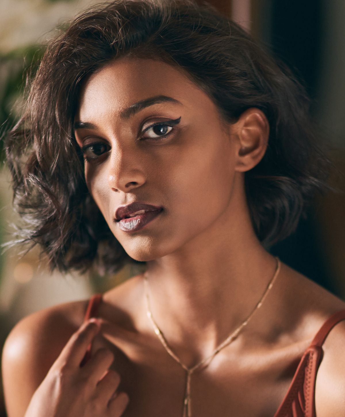 Woman with brown hair and bold eyeliner.