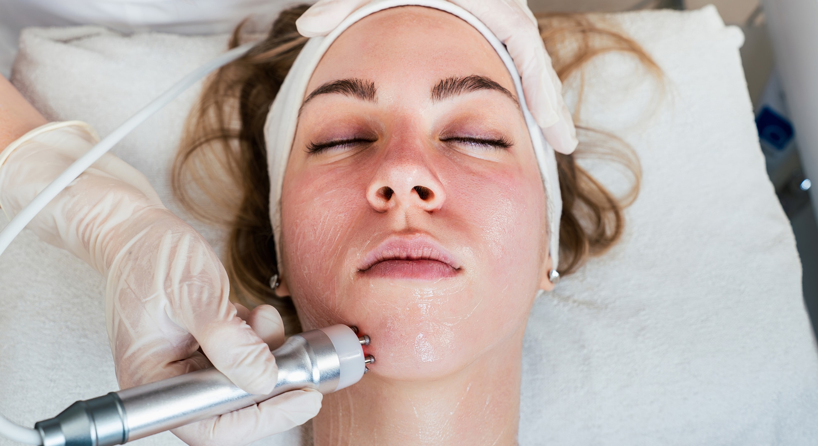 Facial treatment in progress at a spa.